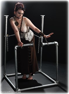 Bondage photo pic picture Roswell Ivory ballgag, barefoot, handcuffs, historical, blouse, skirt, leg irons, chains, metal bondage, ungagged, redhead