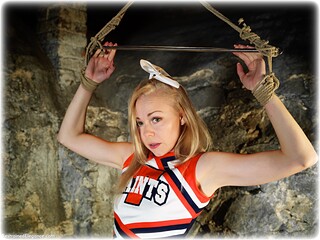 Bondage photo pic picture Lucy Lauren rope bondage, shoes, blonde, skirt, sportswear, spreader bar, pantyhose, tights, ungagged, uniform, cheerleader